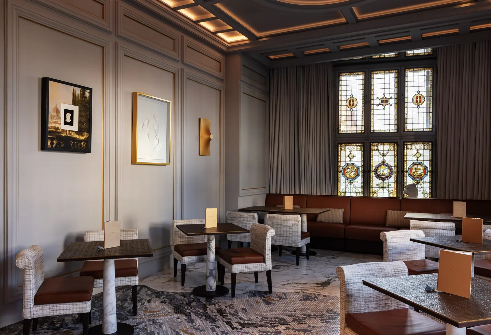 Dining room and golden extroflessed artwork at The Westin Excelsior Florence in Florence